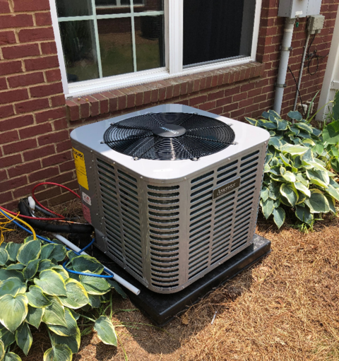 Three hvac units outside of homes