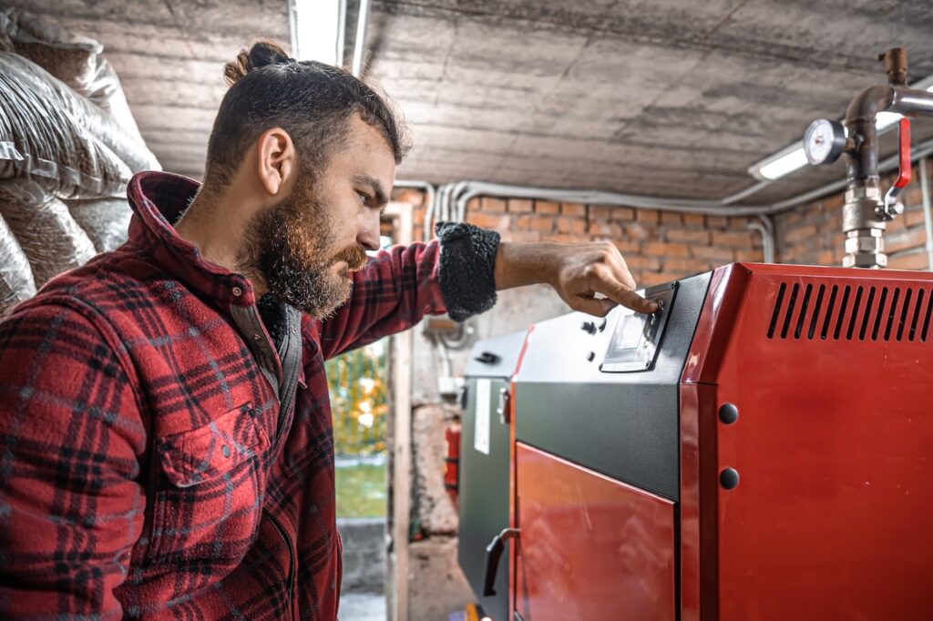 man repairing furnace